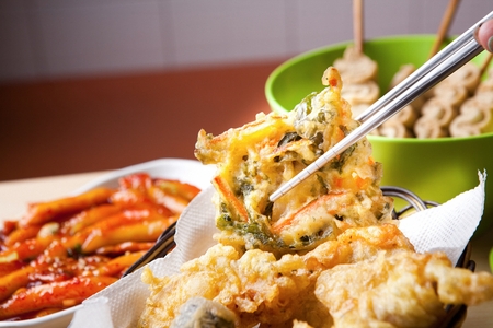 assorted fries, fried vegetables on chopsticksの写真素材