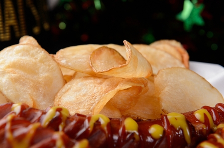 grilled sausage with mustard sauce and poato chipsの写真素材