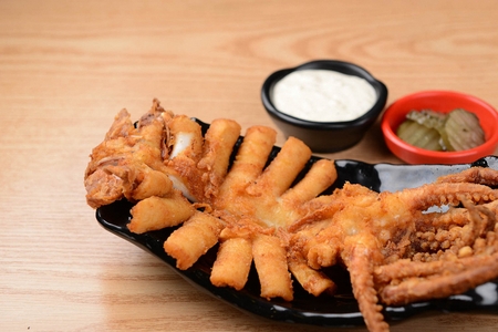fried whole squid, mayonnaise sauce and pickles
