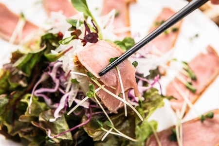 lightly torched beef sashimi with lettuce salad