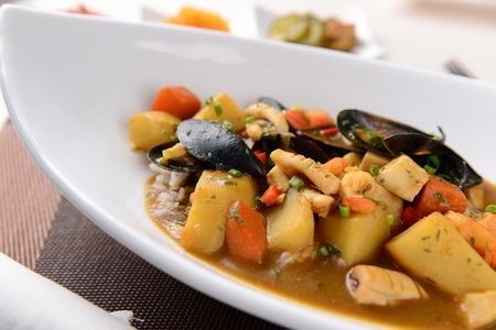 Curry rice bowl with mussels and vegetablesの写真素材