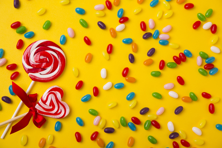 Sweet love, Valentine's day. Heart shaped candy, chocolate, macaroons and rose.の写真素材