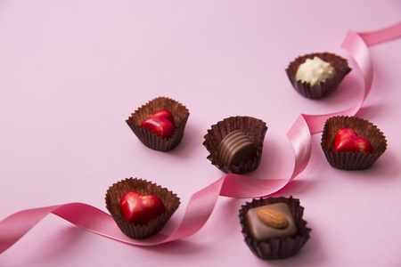 Sweet love, Valentine's day. Heart shaped candy, chocolate, macaroons and rose.の写真素材