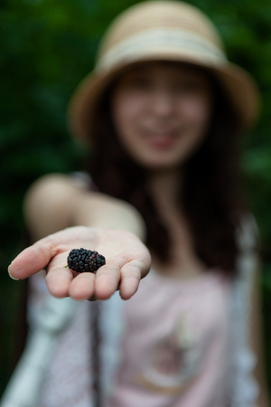 a Mulberry tree of girlの写真素材