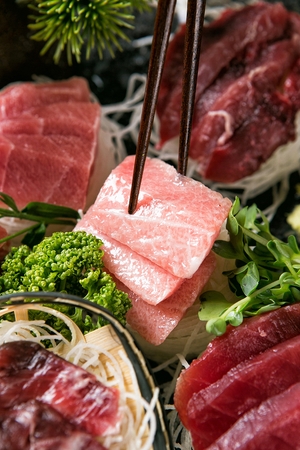 tuna sashimi platter, sashimi on chopsticksの写真素材