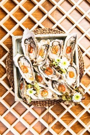 fresh oyster with sliced tomato