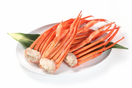 steamed king crab legs on plate, white backgroundの写真素材