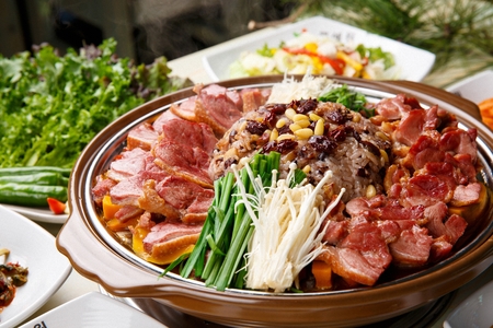 smoked duck in Ttukbaegi, earthen pot, mushroom, chives and nutritious riceの写真素材