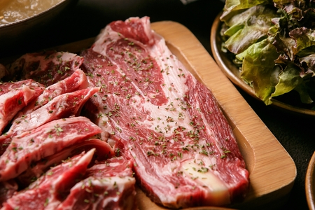 various beef cuts on board