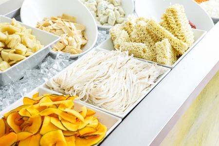 assorted Shabu shabu ingredients on bowls, Shabu shabu bar setting