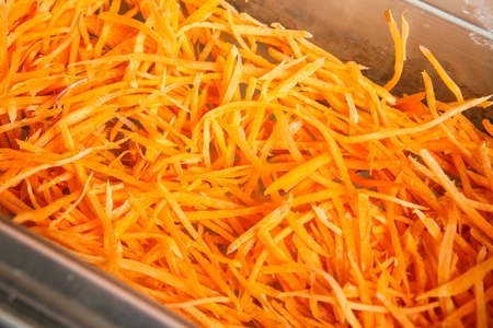 sliced carrots in stainless box