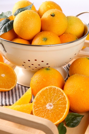 sliced and whole orange fruitsの写真素材