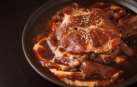 Raw marinated pork spareribs on china plateの写真素材