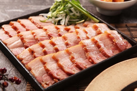 smoked Samgyeopsal pork belly on square bowlの写真素材