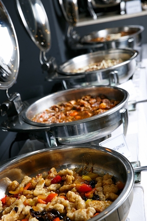 Tangsuyuk, sweet and sour pork and steamed back ribs with vegetables, buffet setting