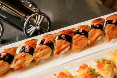 Eel sushi with ginger on long rectangular plateの写真素材