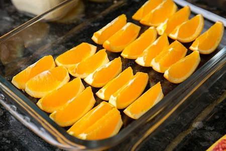 sliced oranges on square glass containerの写真素材