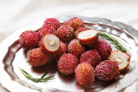 frozen rambutan on stainless plateの写真素材