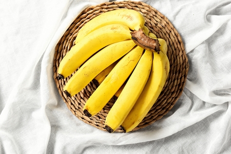 bananas on woven bowlの写真素材