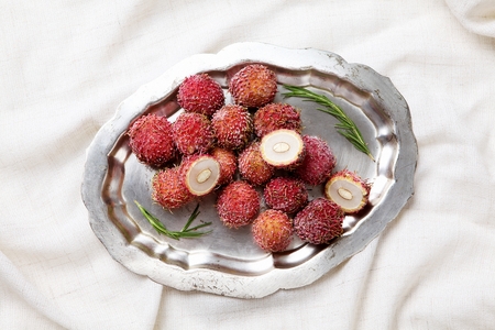 frozen rambutan on stainless plate
