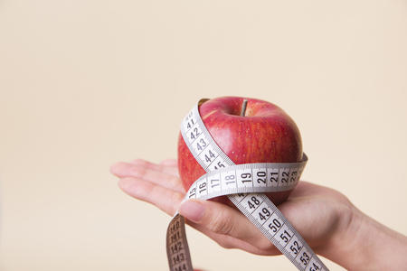 Healthy and weight loss concept,   whole and half pieceの写真素材