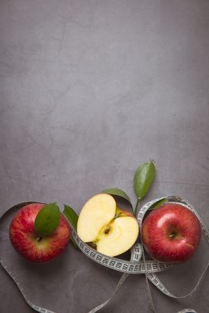 Healthy and weight loss concept, Red  whole and half pieceの写真素材