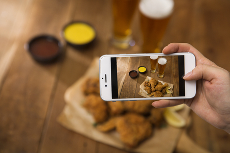 Korean style chicken and beer, delicious fried or spicy sauce chicken with cool beerの写真素材