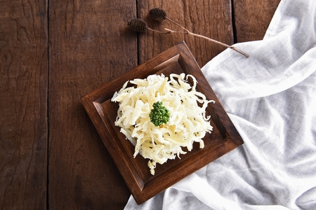 dried squid on rectangular wooden plateの写真素材