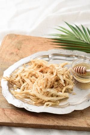 dried squid on silver plateの写真素材