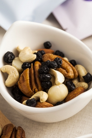 nuts on small white plateの写真素材