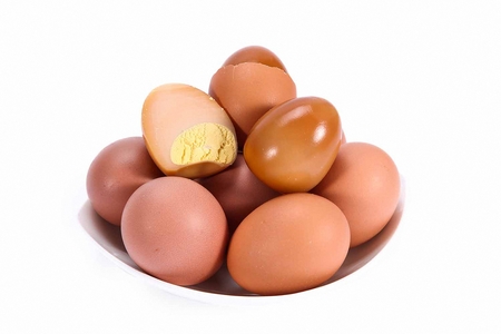 eggs stacked on white plate, in white backgroundの写真素材