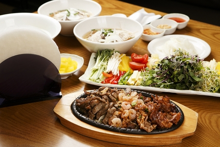 ingredients for vietnamese spring rolls such as sprouts, winter mushrooms on rectangular plate, with...