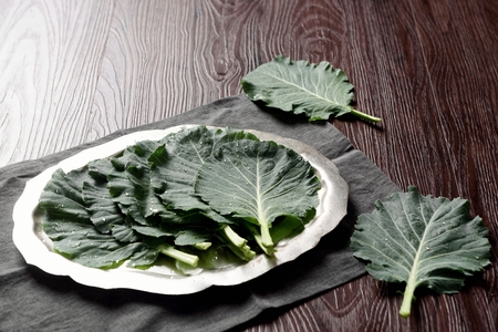 kale on plate and two kales on tableの写真素材