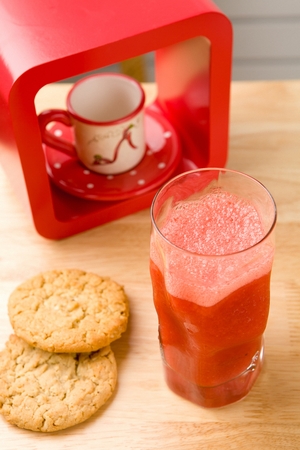 one strawberry juice and two cookiesの写真素材