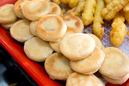 round fried food on plastic plateの写真素材