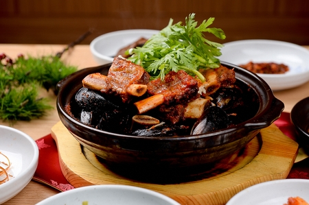 spicy braised seafood and short ribs with vegetablesの写真素材