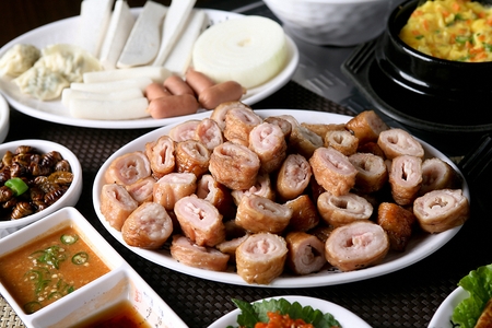 sliced pork entrails, onion and mushroom,Korean barbecue preparationの写真素材