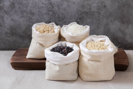 Assortment of Various grains and rice in bowls.