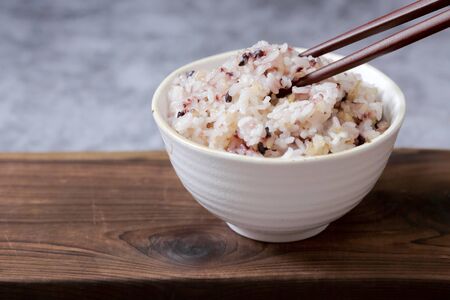 Assortment of Various grains and rice in bowls.の写真素材
