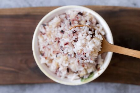 Assortment of Various grains  rice in bowls.の写真素材