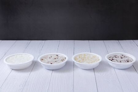 Assortment of Various grains  rice in bowls.の写真素材