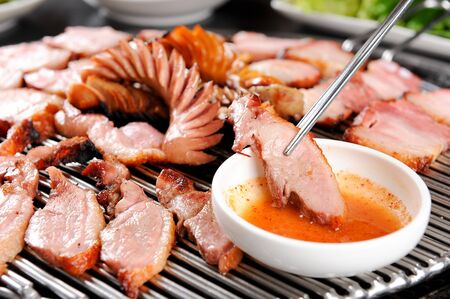 Smoked duck dipped in sauceの写真素材