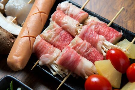 Raw beef brisket roll on plate