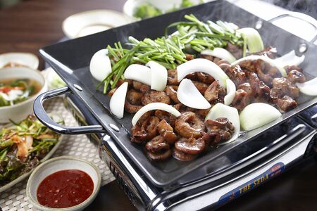 Grilled entrails and onions on grillの写真素材