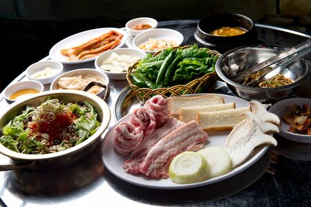 Raw pork with side dishesの写真素材