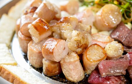 Tripes being grilled on grillの写真素材