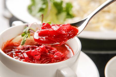 Borsch scooped up with spoonの写真素材