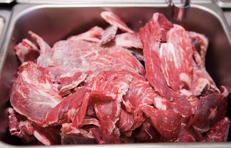 Raw prime ribs on iron plate