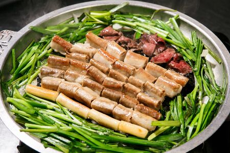 Grilled Entrails with garnished vegetablesの写真素材