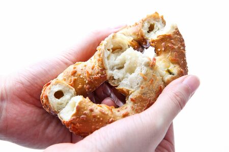 Hand that ripped pretzle in half